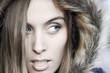 Portrait of a beautiful blue eyed young woman with a hood Portrait of a beautiful blue eyed young woman with a hood