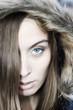 Portrait of a beautiful blue eyed young woman with a hood Portrait of a beautiful blue eyed young woman with a hood