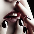 Close-up of lips and nails Close-up of lips and nails