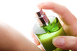 Close-up of a woman spraying her wrist Close-up of a woman spraying her wrist
