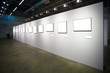 white wall with many empty frames white wall with many empty frames