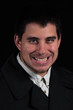 sinister smile of male portrait isolated on black background sinister smile of male portrait isolated on black background