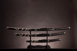 Photo: Katana, wakizashi and tanto, monochromatic lighting. Copy space. Katana, wakizashi and tanto, monochromatic lighting. Copy space.
