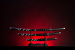 Photo: Katana, wakizashi and tanto on red background. Copy space. Katana, wakizashi and tanto on red background. Copy space.