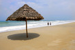 Thatched umbrella on deserted beach, Hoi An Vietnam Thatched umbrella on deserted beach, Hoi An Vietnam