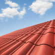 View of red roof tiles and cloudy sky on the background. View of red roof tiles and cloudy sky on the background.