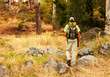 Adventurous young guy trekking in the bush