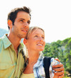 A happy young couple looking at copyspace