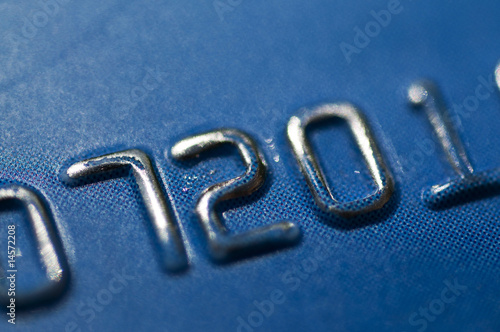 Photo: Close up of credit card account number Close up of credit card account number