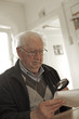 Old man with a magnifying glass