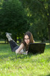 student with laptop outdoors