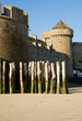 Old fortress wall and traditional wooden stakes at Saint-Malo