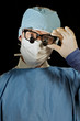 Doctor with microsugery glasses Doctor with microsugery glasses