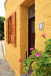 Door and window of yellow house