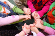 Children stand having joined hands,  top view