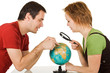 Couple looking at globe