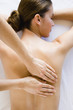 Woman's back being massaged