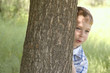 frisky little boy play hide-and-seek