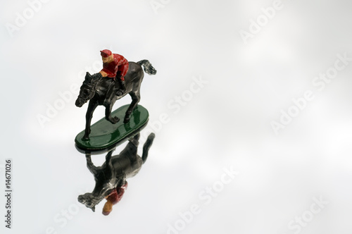 Photo: One race horse and jockey One race horse and jockey