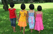 Four children having good time in the park. Four children having good time in the park.