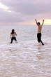 Photo: couple playing in the ocean with clothes on couple playing in the ocean with clothes on