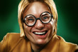 Funny guy grimacing over green background