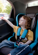 Cute little girl in a car