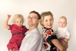 Father and mother with their two little daughters