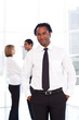 Happy businessman in the office with his team