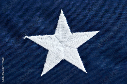 Photo: Close up of a star on an American flag. Close up of a star on an American flag.
