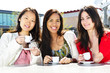 Photo: Group of girlfriends having coffee Group of girlfriends having coffee
