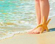 girl's barefoot legs on the sand beach girl's barefoot legs on the sand beach