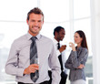 Young businessman in the office with his team