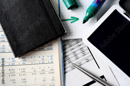 Photo: Daily financial reports, pen, marker and notepad Daily financial reports, pen, marker and notepad