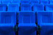 Dark blue rows of theater seats