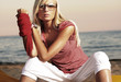 Fashionable woman on the beach in afternoon