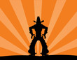 illustration of cowboy against a sunset background illustration of cowboy against a sunset background