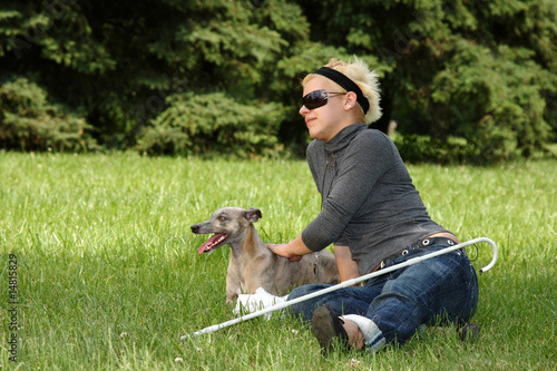 Photo: blind woman playing with her dog blind woman playing with her dog