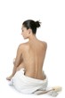 Nude sit woman back with white towel Nude sit woman back with white towel