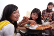 Group of young woman sitting and eating pizza