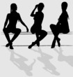 Three vector silhouettes of attractive young woman sitting.