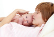 Mother sleeping with her newborn baby