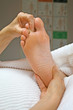 Reflexologist working on second toe