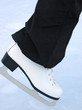 White skate. Woman at the handmade rink