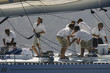 Crew working on yacht, side view