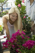 Woman Shopping for Flowers at plant nursery