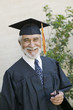 Senior graduate smiling outside, portrait
