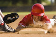 Baseball player sliding into base