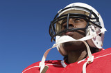 Photo: Football Player wearing helmet on outside, low angle view, close-up, close-up, low angle view Football Player wearing helmet on outside, low angle view, close-up, close-up, low angle view