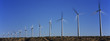 Wind turbines against blue sky